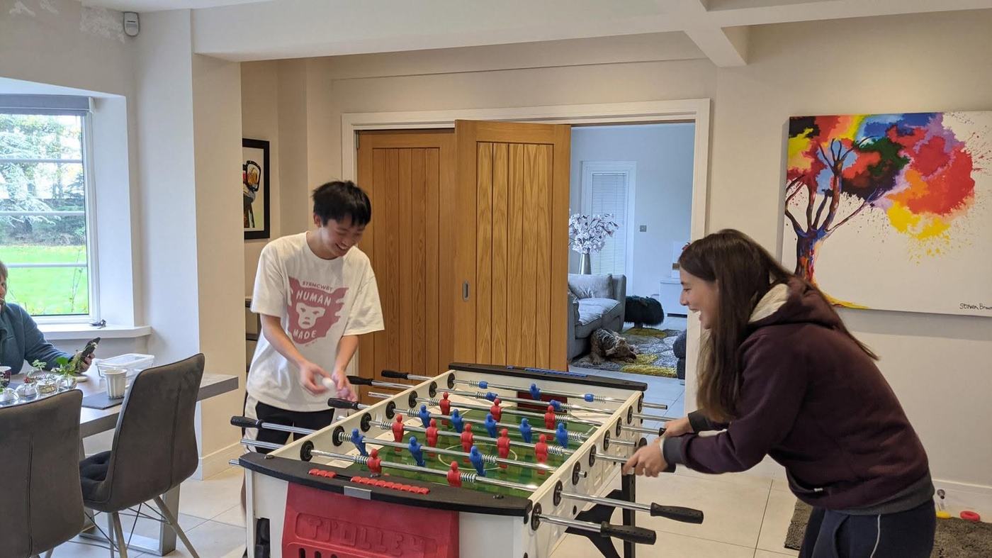 Students playing table football together